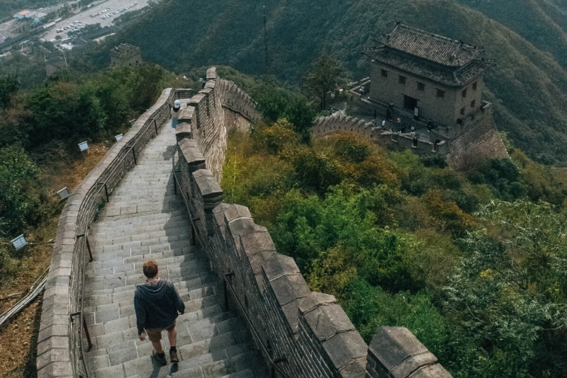 Man walking down Great Wall of China, one of the most instagrammable places in China