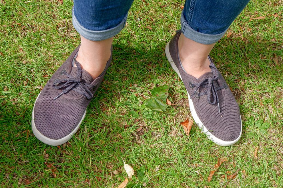 Lady wearing Allbirds Tree Skippers on grass