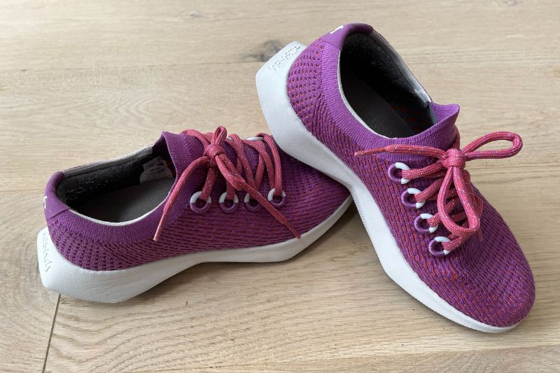 Allbirds Dashers running shoes on a wooden floor