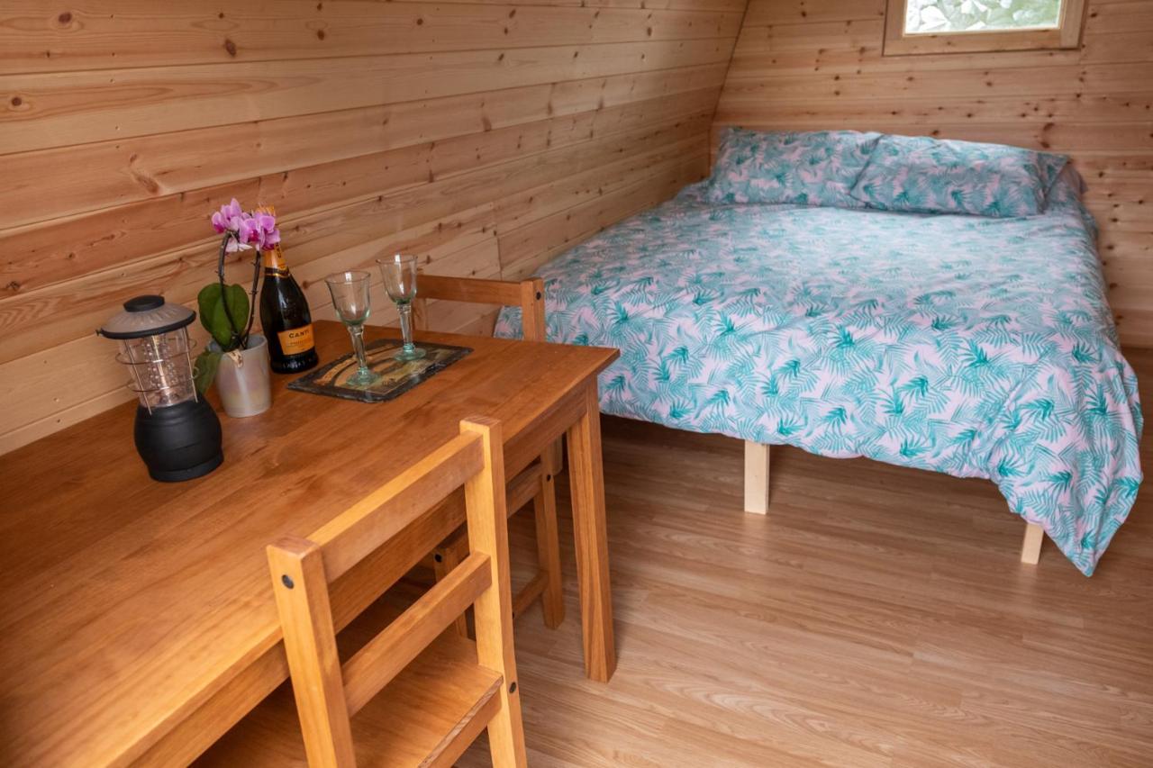 The bedroom at a glamping pod at The Moat Lake in Suffolk