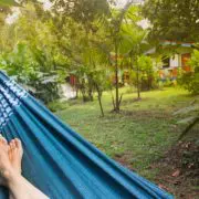 A guest in the jungle, lying on a hammock